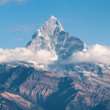 a view of the mountains from in the clouds